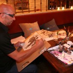 How glamourous! Vogue and Model.live's very own artist capturing the event (Duke Donovan: artscounselinc.com)