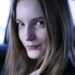 Dorothea, in her car, stays relaxed