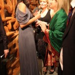 Patricia in Carlos Miele greeting her guests.