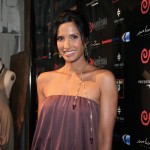Padma in vintage Halston is wearing pieces from her jewelry line, at Padmalakshmi.com