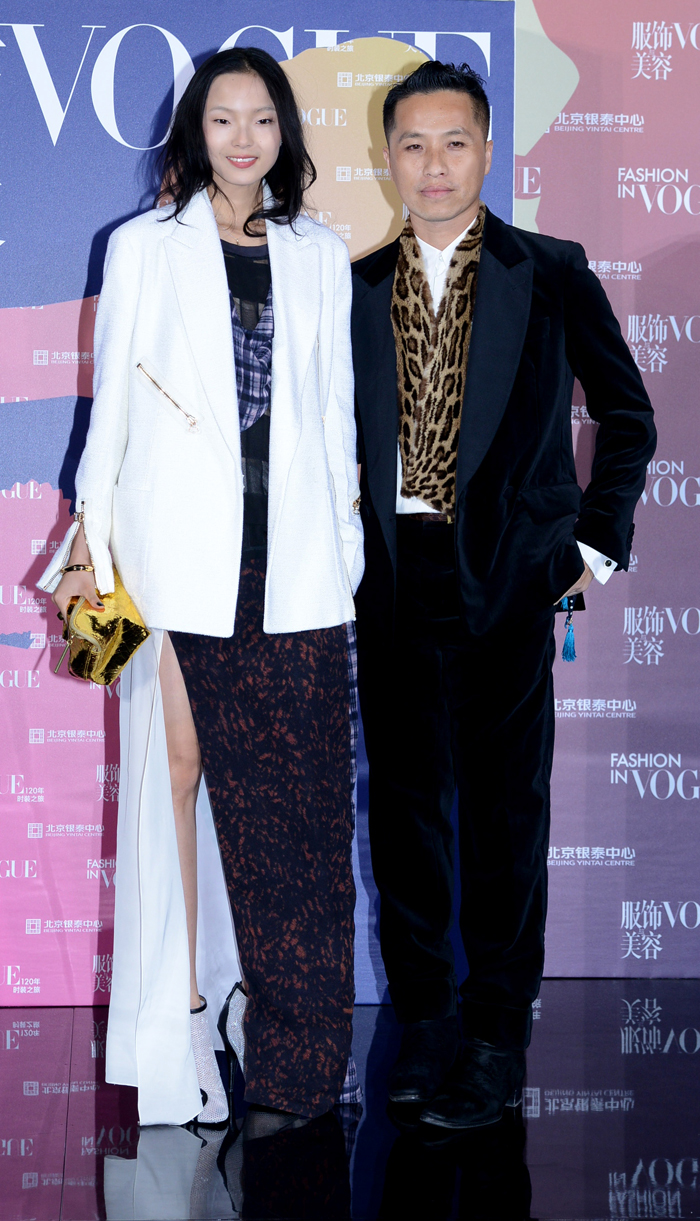 Phillip-Lim-with--Xiaowen-Ju-in-3.1-Phillip-Lim,-with-Bulgari-clutch
